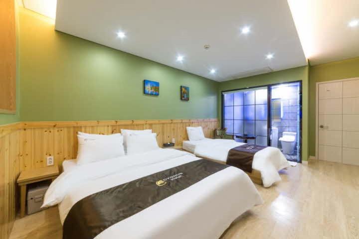 Cygnus Hotel Asan Buitenkant foto